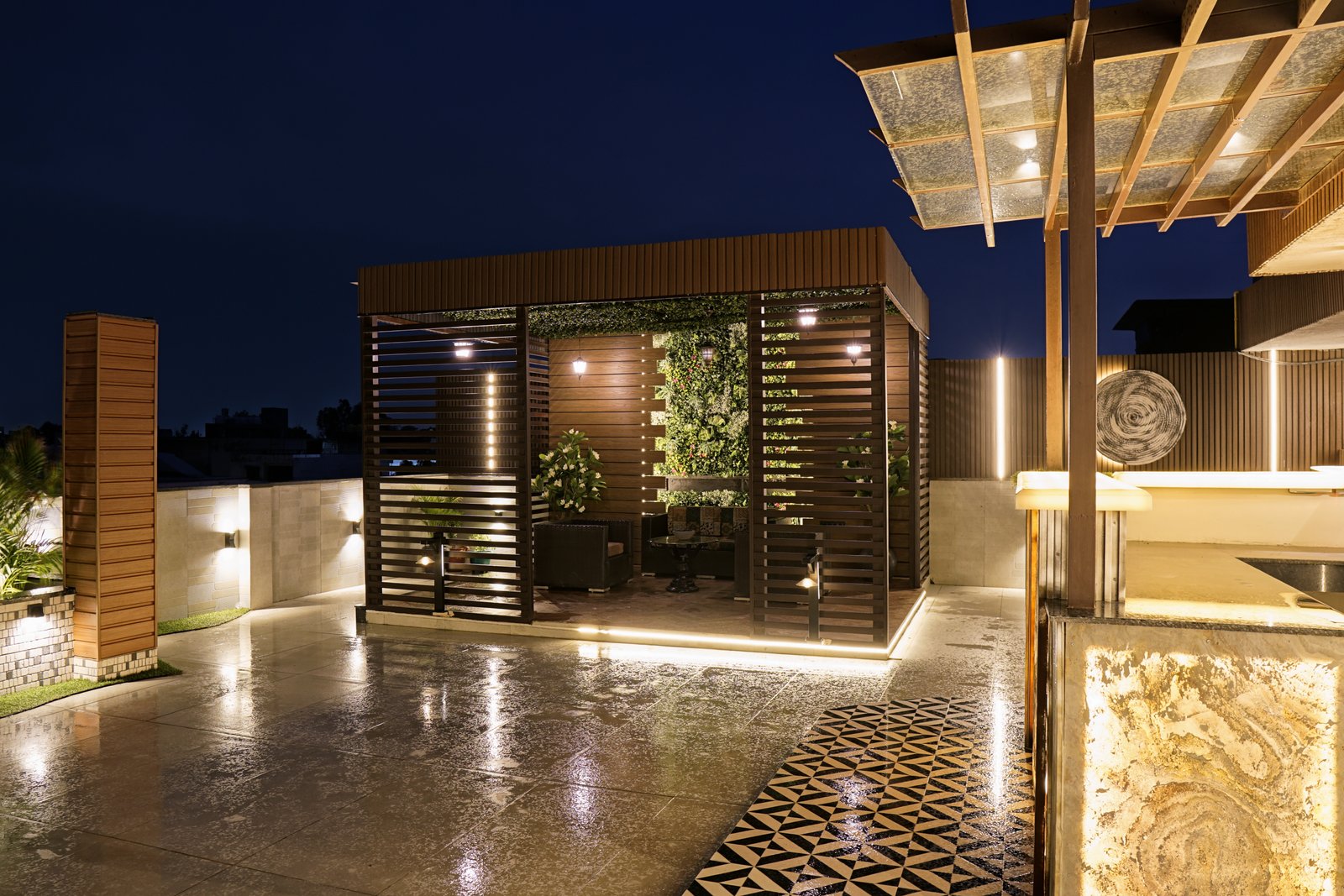 Punjabi Bagh rooftop — covered garden lounge with slatted screens