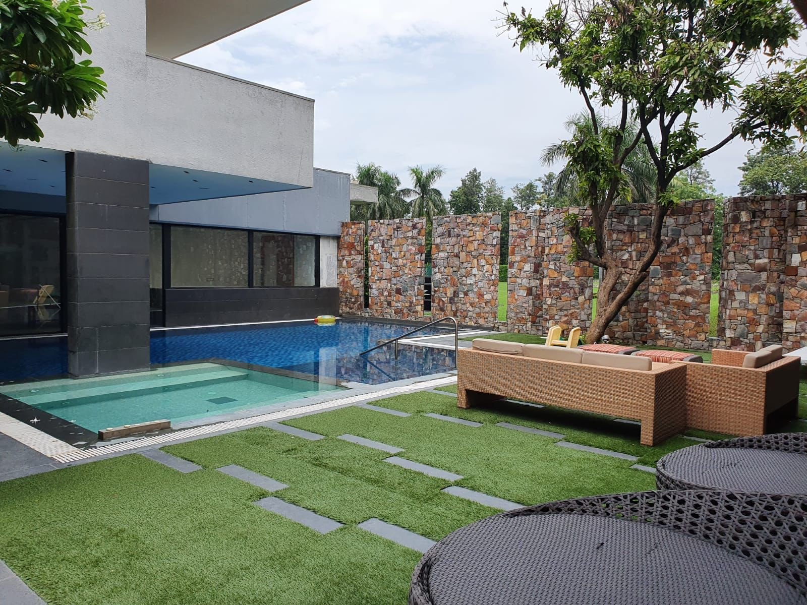 Villa swimming pool with landscaped garden surround